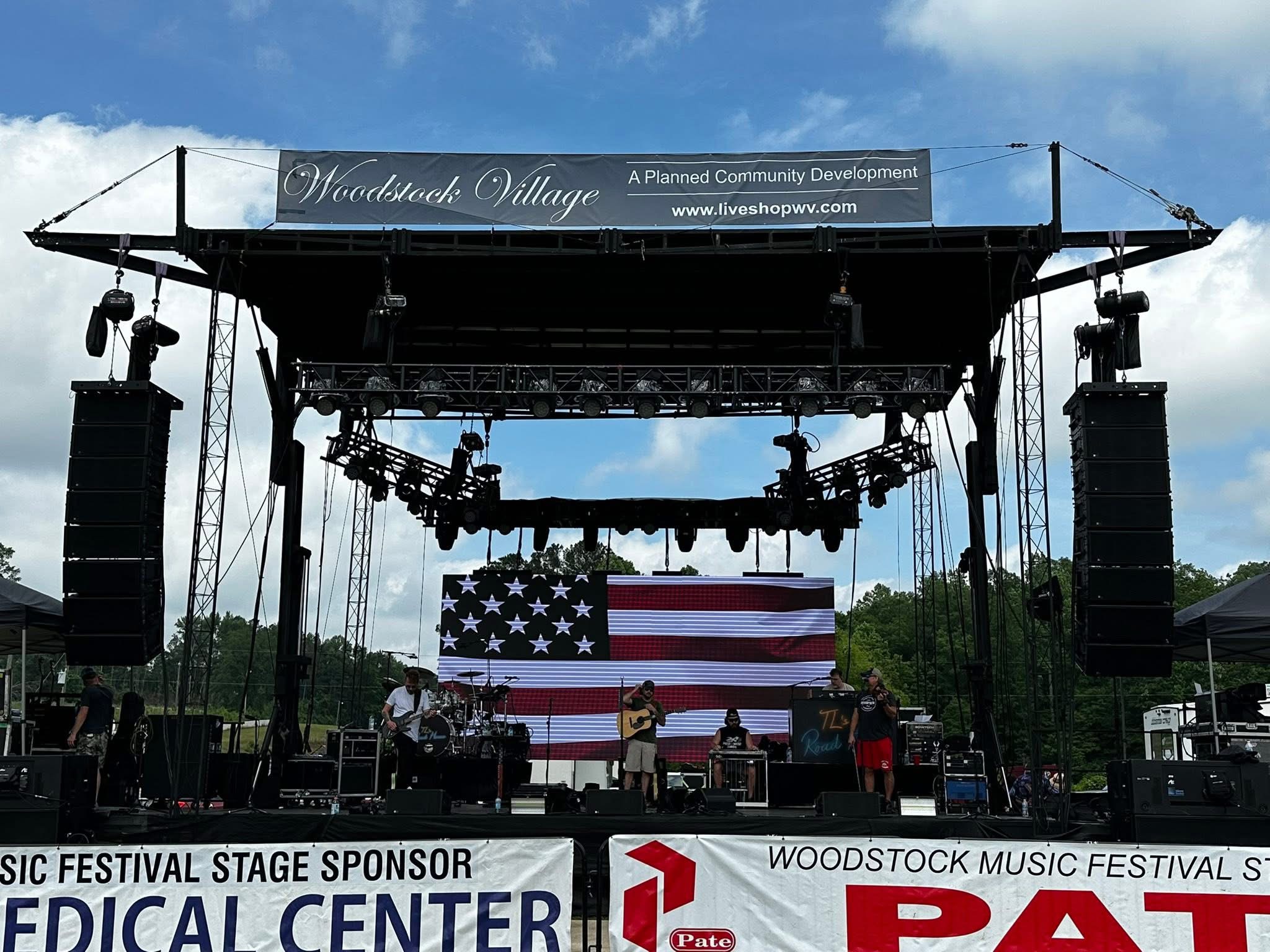 Elite Productions full festival mainstage build with line arrays, video walls, and lighting rig