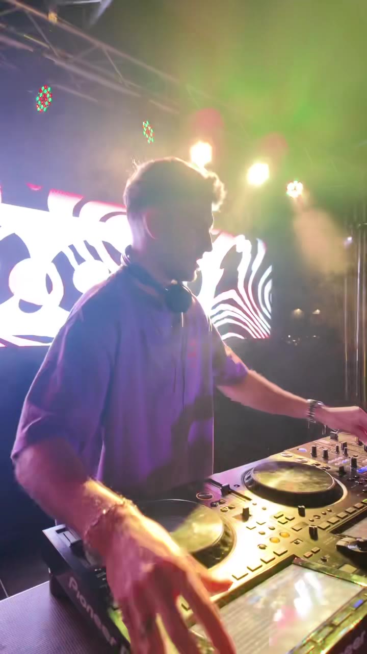 DJ booth with custom truss structure and concert lighting